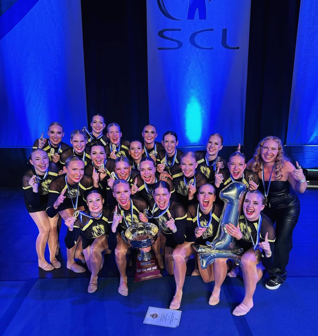 Dream Team Dancers celebrating with their trophy